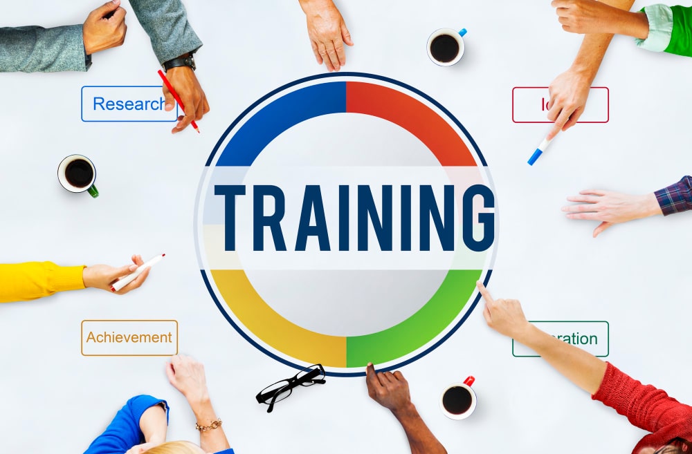 Hands pointing to the text "Training"